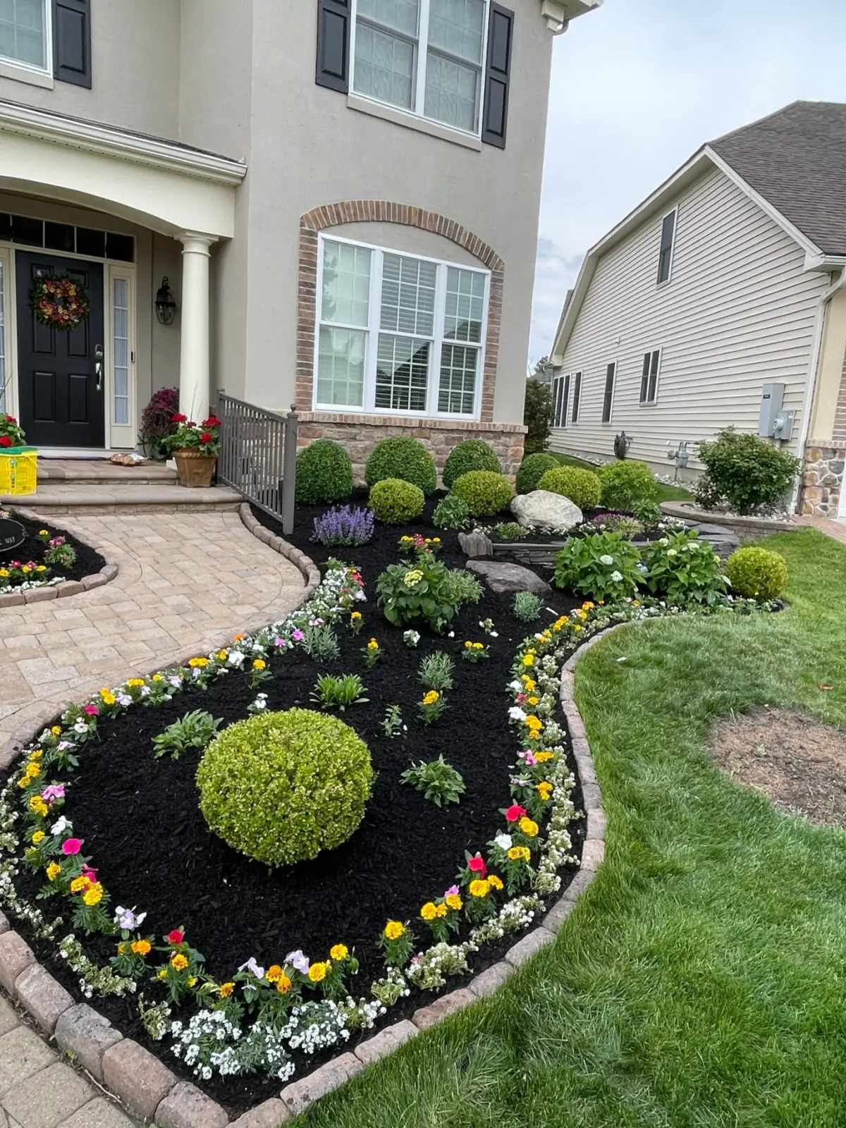 Finished bed with mulch and new plants close up