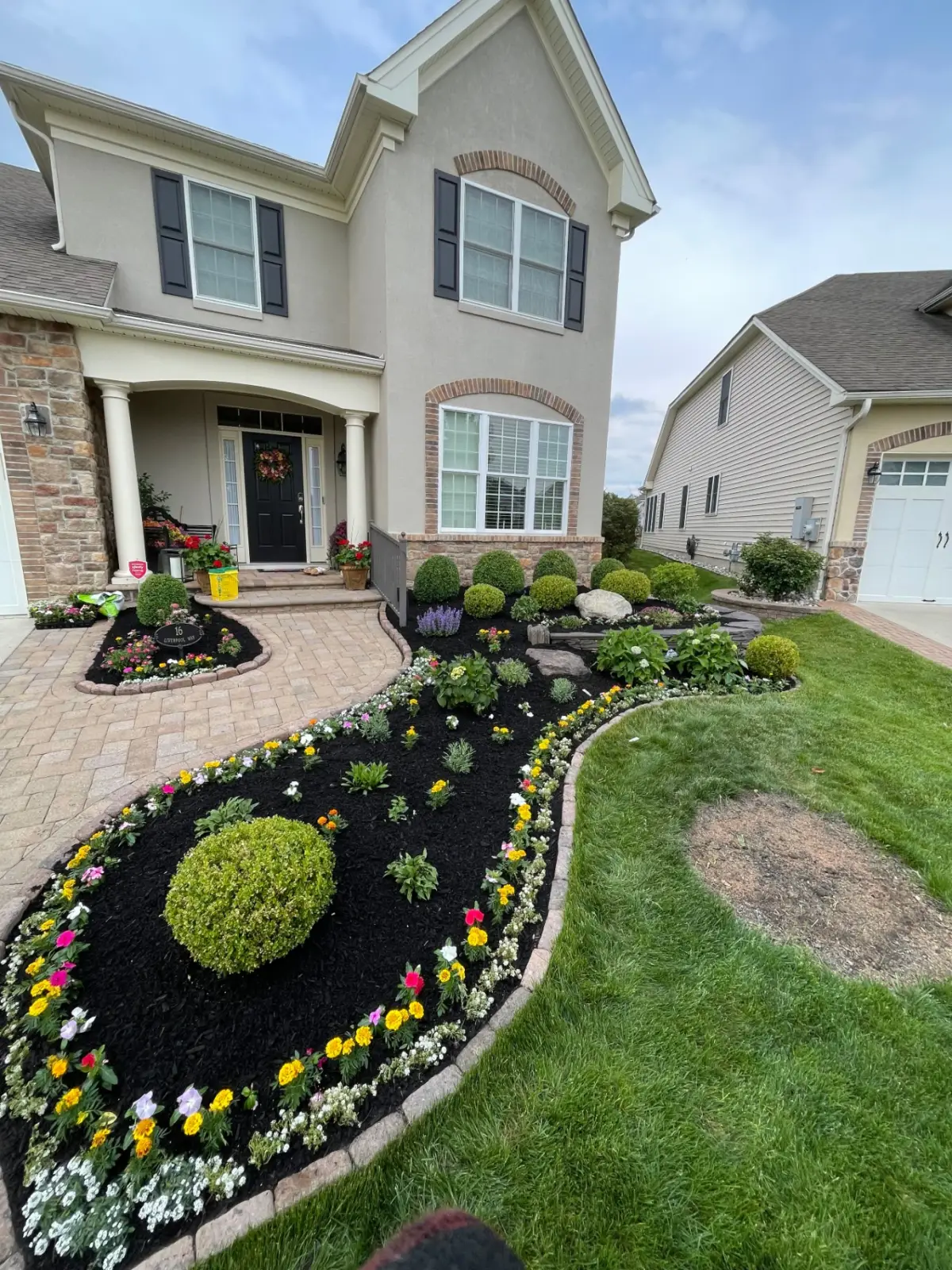 Walkway and finished yard after hardscaping work