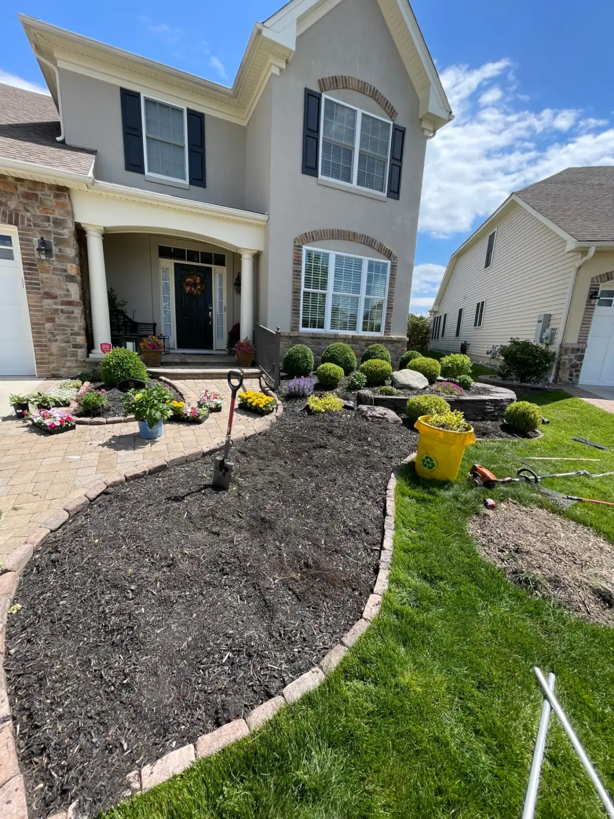 Side yard beds finished with fresh mulch and plants