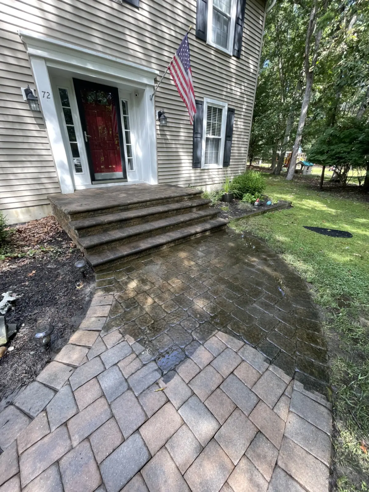 Front pavers being power washed