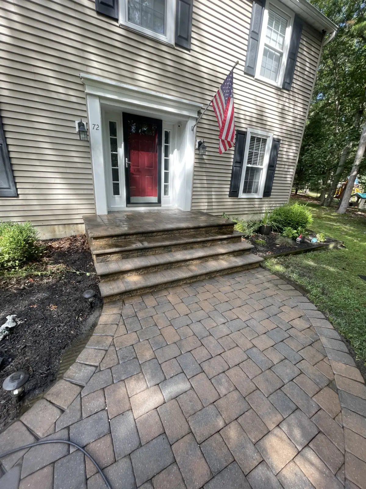Front pavers cleaned after power washing